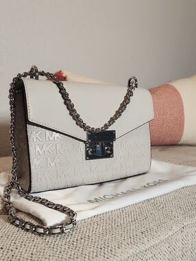 Michael Kors Rose Small Crossbody in bright white features a textured MK